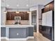 Modern kitchen with stainless steel appliances and an island at 5607 Tidewater Preserve Blvd, Bradenton, FL 34208