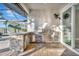 Outdoor kitchen with stainless steel appliances and stone countertop at 5607 Tidewater Preserve Blvd, Bradenton, FL 34208