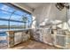 Outdoor kitchen with stainless steel appliances and stone countertop at 5607 Tidewater Preserve Blvd, Bradenton, FL 34208