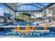 Enjoy this relaxing pool area with fire pit and covered patio at 5607 Tidewater Preserve Blvd, Bradenton, FL 34208