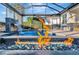 Enjoy this relaxing pool area with fire pit and covered patio at 5607 Tidewater Preserve Blvd, Bradenton, FL 34208