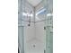 Large walk-in shower with hexagon tile floor and glass enclosure at 5607 Tidewater Preserve Blvd, Bradenton, FL 34208