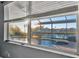 Bedroom view of pool, spa and canal at 5607 Tidewater Preserve Blvd, Bradenton, FL 34208