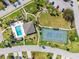 Aerial view of the pool and tennis court area at 5724 Doral Dr, Sarasota, FL 34243