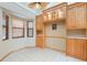 A charming breakfast nook features built-in cabinets, a tile floor, and natural light at 5724 Doral Dr, Sarasota, FL 34243