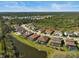 Aerial view of a community with houses and a lake at 6625 Dovekey Dr, Sarasota, FL 34241