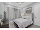 Cozy bedroom with a queen bed and neutral decor at 6625 Dovekey Dr, Sarasota, FL 34241