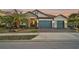 Beautiful two-story house with stone accents and a three-car garage at 6625 Dovekey Dr, Sarasota, FL 34241