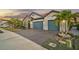 Two-story house with three-car garage and landscaped yard at 6625 Dovekey Dr, Sarasota, FL 34241