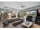 Relaxing living room, leather furniture, open to kitchen and patio at 6625 Dovekey Dr, Sarasota, FL 34241