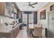 Home office with built-in cabinetry and large desk at 6625 Dovekey Dr, Sarasota, FL 34241