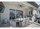 Cozy outdoor dining area with a concrete table and wicker chairs at 6625 Dovekey Dr, Sarasota, FL 34241
