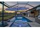 Stunning pool with spa, fire pit, and covered lanai at 6625 Dovekey Dr, Sarasota, FL 34241