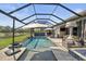 Resort-style pool area with a screened enclosure and fire pit at 6625 Dovekey Dr, Sarasota, FL 34241