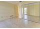 Simple bedroom with mirrored closet doors and tile floors at 6704 11Th W Ave, Bradenton, FL 34209