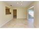 Dining area with kitchen pass-through and access to a sunroom at 6704 11Th W Ave, Bradenton, FL 34209