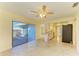 Dining room with tile floors and access to kitchen and sunroom at 6704 11Th W Ave, Bradenton, FL 34209