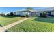 Condo exterior with well-manicured lawn and walkway at 6704 11Th W Ave, Bradenton, FL 34209