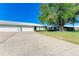 Condo building exterior with two-car garage and lawn at 6704 11Th W Ave, Bradenton, FL 34209
