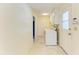 Laundry room with washer, dryer, and access to a hallway at 6704 11Th W Ave, Bradenton, FL 34209
