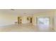 Open living room with tile floors and views into adjacent areas at 6704 11Th W Ave, Bradenton, FL 34209