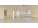 Spacious living room featuring tile floors and access to other rooms at 6704 11Th W Ave, Bradenton, FL 34209