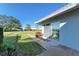 Small patio next to the condo with a sliding glass door at 6704 11Th W Ave, Bradenton, FL 34209