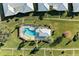 Community pool with surrounding lounge chairs and gazebo at 6704 11Th W Ave, Bradenton, FL 34209