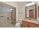 Updated bathroom with glass shower, tile flooring, and modern vanity at 7340 Silver Fern Blvd # 5, Sarasota, FL 34241