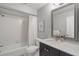 Clean bathroom with white tile, shower/tub combo and a modern vanity at 7340 Silver Fern Blvd # 5, Sarasota, FL 34241