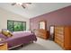 Main bedroom with large window, walk-in closet, and dresser at 7340 Silver Fern Blvd # 5, Sarasota, FL 34241