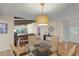 Dining room with glass table and kitchen view at 7340 Silver Fern Blvd # 5, Sarasota, FL 34241