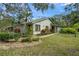 Single-story home with landscaped yard and driveway at 7340 Silver Fern Blvd # 5, Sarasota, FL 34241