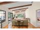 Living room with hardwood floors and access to patio at 7340 Silver Fern Blvd # 5, Sarasota, FL 34241