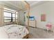 Bright bedroom featuring a canopy bed and water view at 9048 Bernini Pl, Sarasota, FL 34240