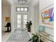 Bright and airy foyer with double doors and rug at 9048 Bernini Pl, Sarasota, FL 34240