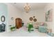 Gathering room with a cozy sectional sofa and large artwork at 9048 Bernini Pl, Sarasota, FL 34240