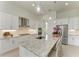 Spacious kitchen with granite countertops, stainless steel appliances, and white cabinets at 9048 Bernini Pl, Sarasota, FL 34240