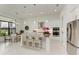 Modern kitchen with white cabinets and stainless steel appliances at 9048 Bernini Pl, Sarasota, FL 34240