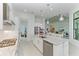 Modern kitchen featuring granite counters, stainless steel appliances, and an island at 9048 Bernini Pl, Sarasota, FL 34240