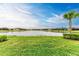 Peaceful lake view with homes and lush landscaping at 9048 Bernini Pl, Sarasota, FL 34240