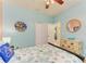 Serene bedroom featuring coastal decor and built-in shelving at 11306 77Th E St, Parrish, FL 34219