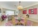 Dining room with glass-top table and pink chairs at 11306 77Th E St, Parrish, FL 34219
