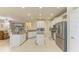 Spacious kitchen with island, stainless steel appliances, and granite at 11306 77Th E St, Parrish, FL 34219