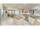 Island kitchen with granite countertops, breakfast nook, and stainless steel appliances at 11306 77Th E St, Parrish, FL 34219