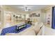 Open concept living room with a view of kitchen and backyard at 11306 77Th E St, Parrish, FL 34219