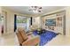 Spacious living area featuring comfortable seating and backyard access at 11306 77Th E St, Parrish, FL 34219