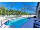 Spacious screened pool and spa with surrounding patio at 11306 77Th E St, Parrish, FL 34219