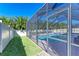 Private backyard oasis featuring a screened pool and spa at 11306 77Th E St, Parrish, FL 34219
