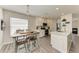 Bright kitchen with white cabinets and a breakfast table at 11343 Walden Loop, Parrish, FL 34219